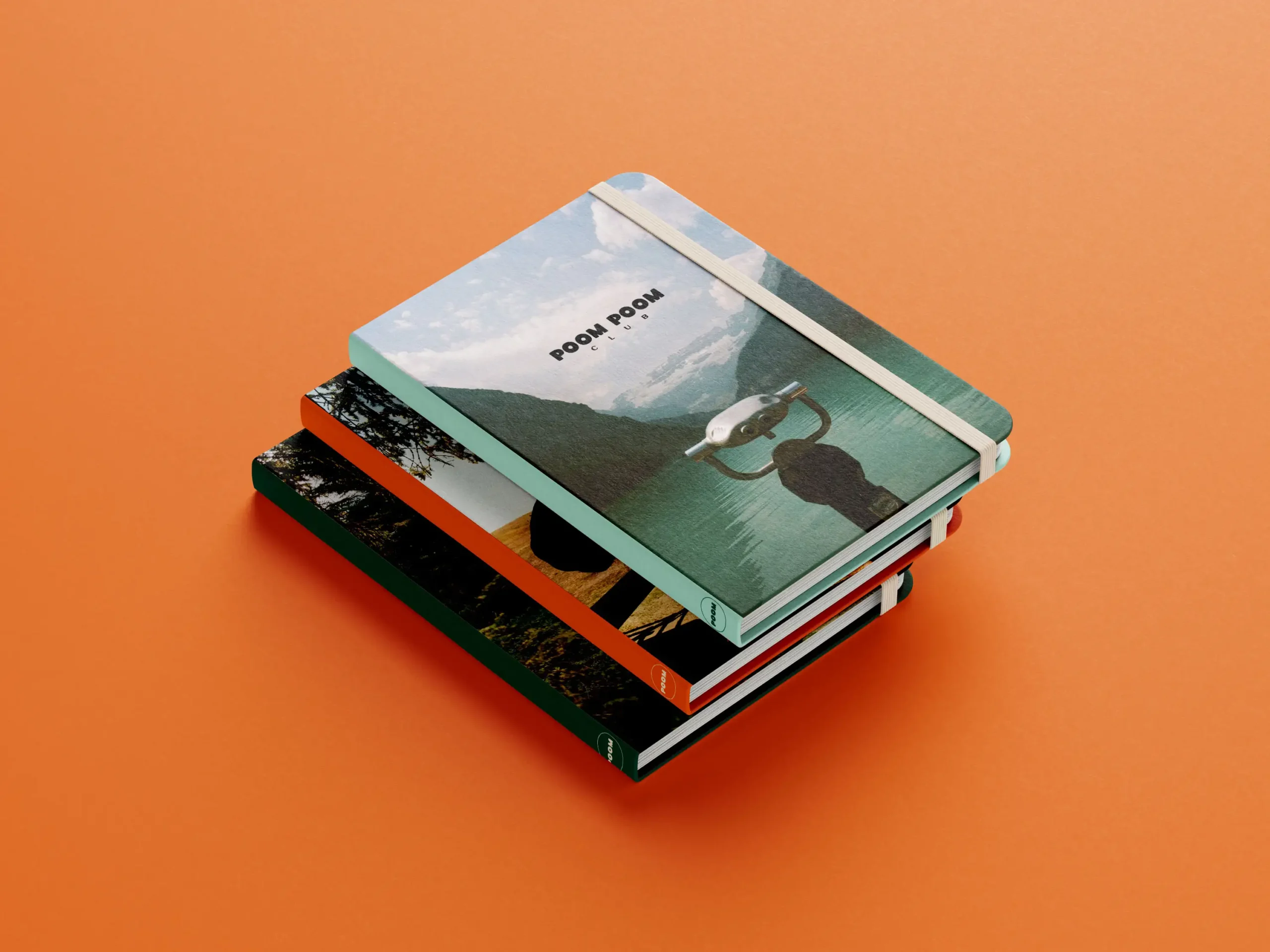 Trois carnets avec des photos de l'Alberta empilés