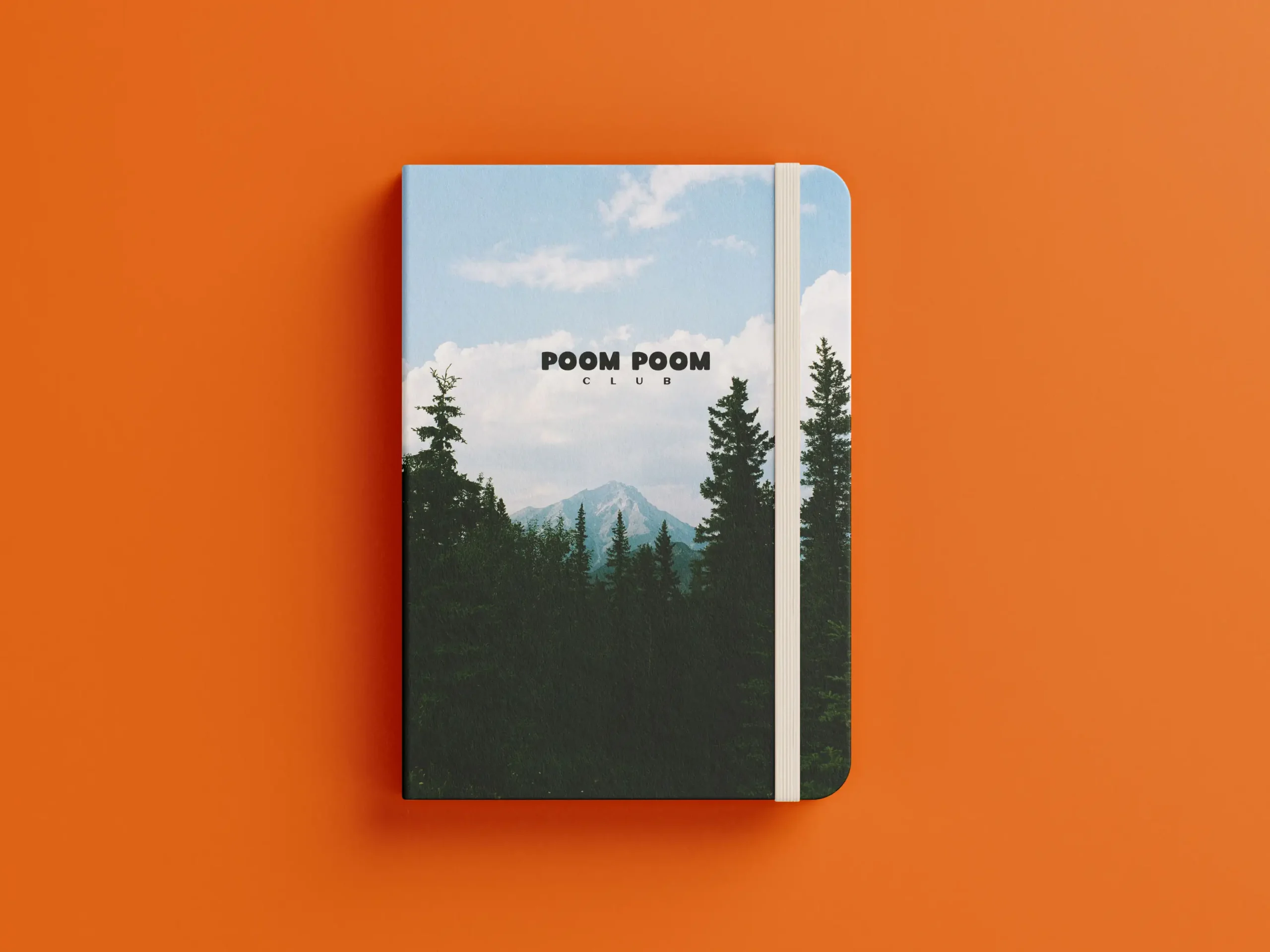 Carnet de notes avec une foret et une montagne en couverture